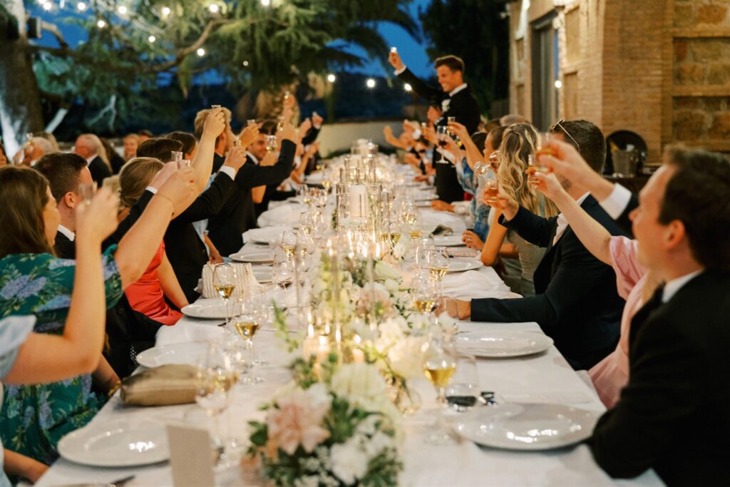 Outdoor wedding dinner with beige florals in Spain. 
